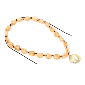 Bohemian style necklace featuring amber jelly beads and a golden shell pendant on white