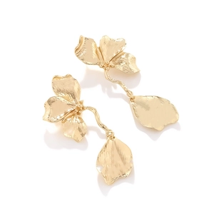 Vintage long gold floral drop earrings with textured 3D leaves and flower design