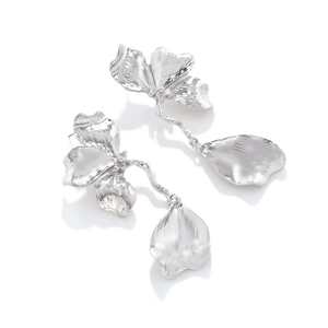 Silver vintage floral drop earrings with textured metal petals in a long dangle design
