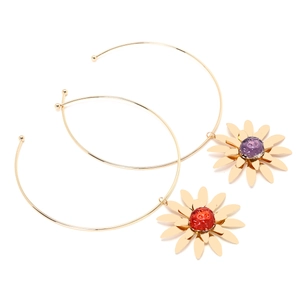 Detail of gold circular drop earrings with large floral pendants in red and purple