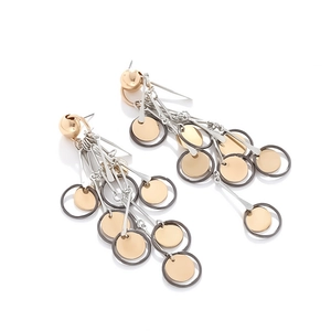 Long vintage gold disc tassel drop earrings with geometric circular metallic elements