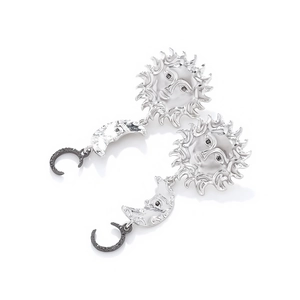 Detail of vintage sun and moon drop earrings with silver finish and black rhinestone inlay