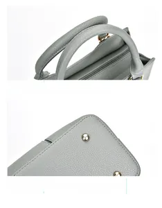 Détails du sac en cuir gris-vert avec poignées rondes et rivets de protection