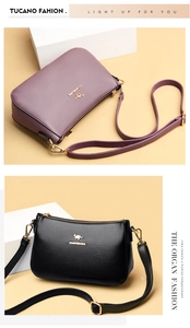 Close-up of litchi grain leather crossbody bags in purple and black with golden hardware