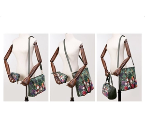 Detail view of the forest print handbag set including crossbody bag and wallet on mannequin