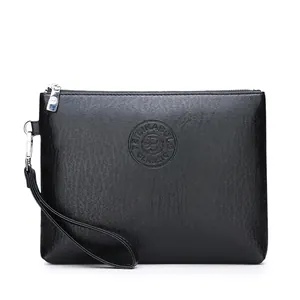 Detail of black textured leather clutch bag with embossed logo and wrist strap