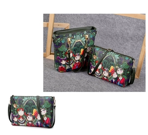 Detail of green bohemian printed tote and crossbody bag set with gold hardware accents