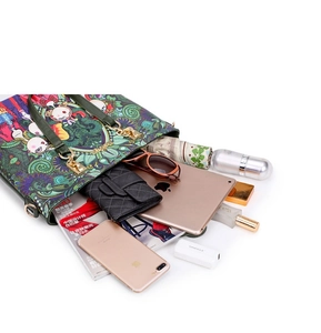 Top view of floral print tote bag showing large capacity for iPad, wallet and phone