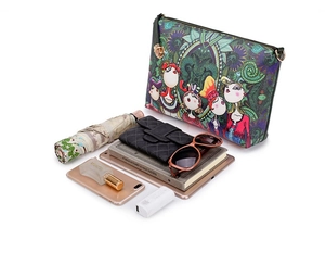 Spacious printed handbag shown with umbrella, tablet and accessories to display high capacity