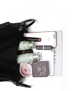 Top view of large capacity black embossed tote showing interior storage for tablet and cosmetics