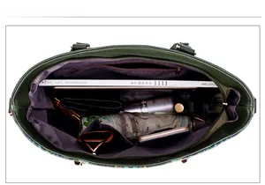 Top view showing spacious purple interior with multiple pockets and daily essentials