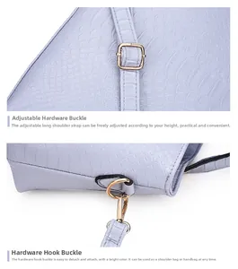 Detail of light purple crocodile embossed leather bag with adjustable gold-tone metal buckle