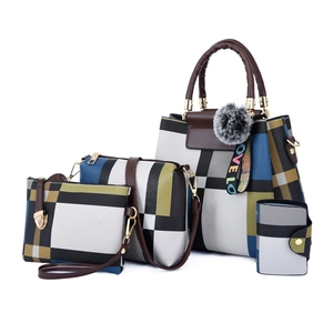 Modern 4-piece handbag set with geometric pattern and pompom charm on white background