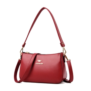 Burgundy faux leather shoulder bag with lychee texture and gold metal kangaroo logo