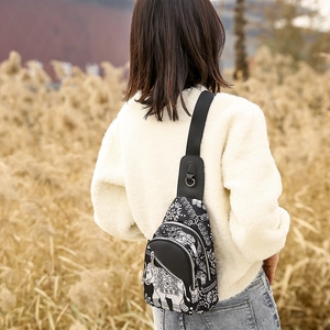 Detailed view of bohemian elephant pattern chest bag with nylon adjustable strap