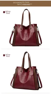 Détail du sac cabas bordeaux avec double poignée et bandoulière sur fond blanc immaculé
