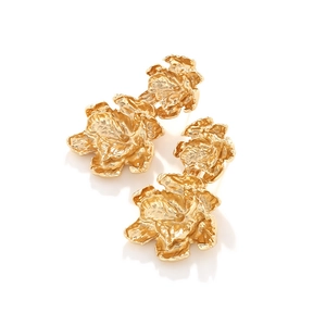 Detail of double-layered gold flower earrings featuring a textured metallic finish