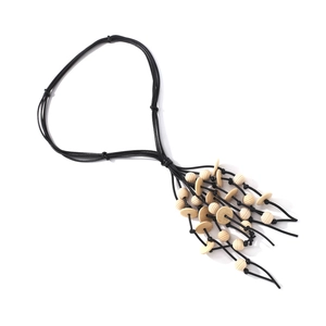 Bohemian multi-layer necklace with wooden beads and tassels on black cord, top view