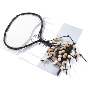 Bohemian multi-layer black rope necklace with wooden beads and tassel charms