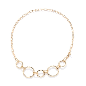Golden geometric waist body chain featuring hammered circle links on a white background