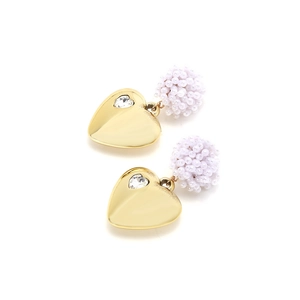 Detail of vintage heart earrings with gold plating, white beads and sparkling rhinestone