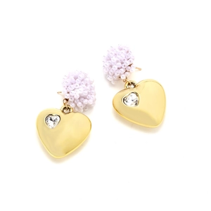 Vintage heart earrings with white beaded details and gold finish on white background