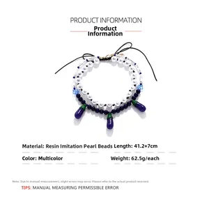 Detail view of pearl and resin eggplant pendant necklace with sizing specifications