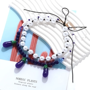 Faux pearl beaded necklace set with purple eggplant charms and floral accents