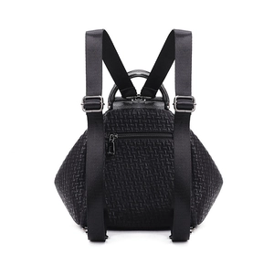 Back view of stylish black embossed backpack with metal ring handle and zipper pocket