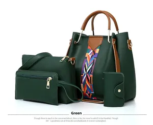 Detail view of the four-piece dark green handbag set with ethnic style woven straps