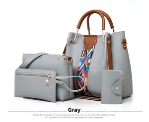 Grey 4-piece handbag set featuring a large tote with colorful geometric woven strap detail
