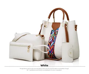Detail of four-piece white litchi leather bag set with geometric woven strap and gold hardware