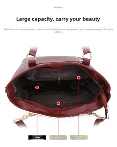 Detailed view of the burgundy tote bag interior showing multi-compartment structure