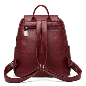 Rear view of burgundy pebble leather backpack with anti-theft zipper and adjustable straps