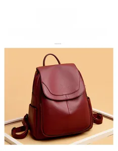 Close-up of litchi texture leather backpack with kangaroo embossed logo and side zippers