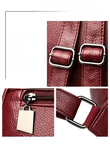 Detailed macro view of burgundy lychee leather texture and gunmetal hardware accents