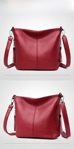 Detail view of red lychee textured leather bucket bag with tassel and logo engraving
