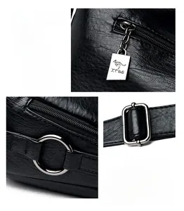 Macro detail of black litchi grain leather texture and shiny silver metal hardware