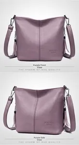 Detail of purple lychee textured leather bucket bag featuring tassels and logo
