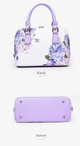Detail view of printed shell bag showing back panel and bottom studs in purple finish