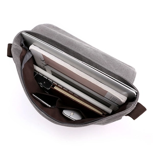 Men's grey canvas messenger bag with internal compartments for laptop and stationery