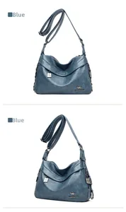Blue leather crossbody bag featuring lychee texture and decorative metal chain details