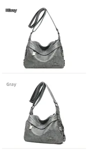 Detail of dark grey PU leather handbag with adjustable strap and metal kangaroo logo