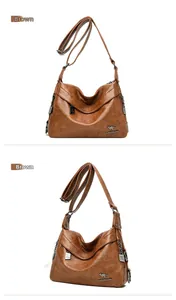 Detail of tan faux leather crossbody bag with kangaroo logo and adjustable strap