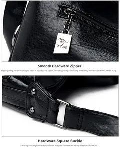 Detailed macro of silver metal zipper pull with kangaroo logo and textured black leather