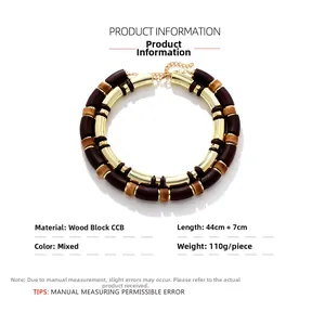 Detail view of double-layer geometric necklace with wood beads and gold accents