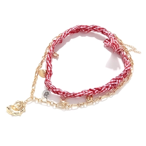 Multilayer ocean necklace with woven cord and golden starfish and seashell pendants