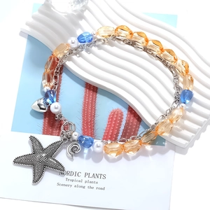 Multilayer ocean necklace with starfish, heart and seashell charms in colorful beads