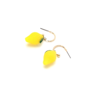 Vibrant yellow lemon drop earrings with green leaf detail and gold hooks on white background