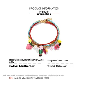 Detailed chart showing resin charms and pearl necklace specs with strawberry accents